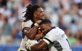Vinaya Habosi of Fiji celebrates scoring his team's second try with teammates Selestino Ravutaumada and Temo Mayanavanua of Fiji during the Rugby World Cup France 2023 match between Fiji and Georgia at Nouveau Stade de Bordeaux on 30 September, 2023 in Bordeaux, France.