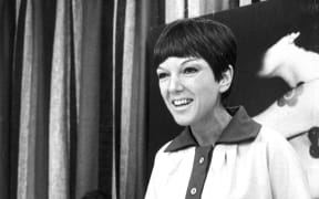 STOCKHOLM SWEDEN, 1966-08-18
Fashion designer Mary Quant during a visit to Sweden August 18, 1966.
Here at Åhlén's department store to talk about make-up. In the background her husband Alexander Plunket Greene.
Foto: TT Code: 20360 (Photo by TT / TT NEWS AGENCY / TT News Agency via AFP)