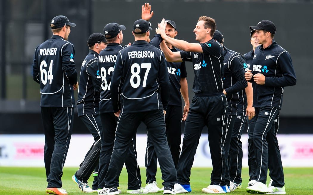 The Black caps celebrate taking the wicket of Chris Gayle.