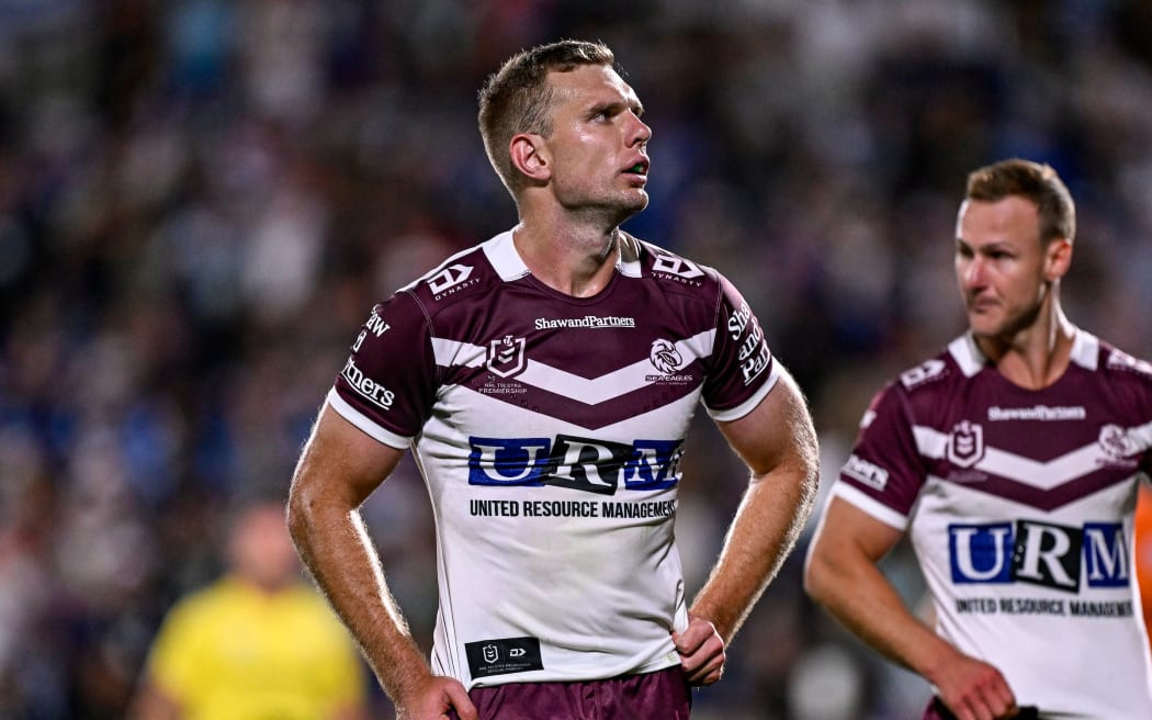 Tom Trbojevic and Daly Cherry Evans of the Sea Eagles dejected after the Warriors score a try.