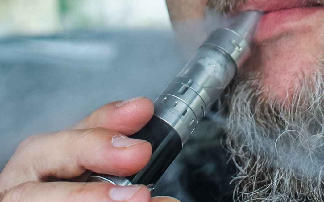 Man vaping while driving a car is seen in Gdansk, Poland on 9 July 2019