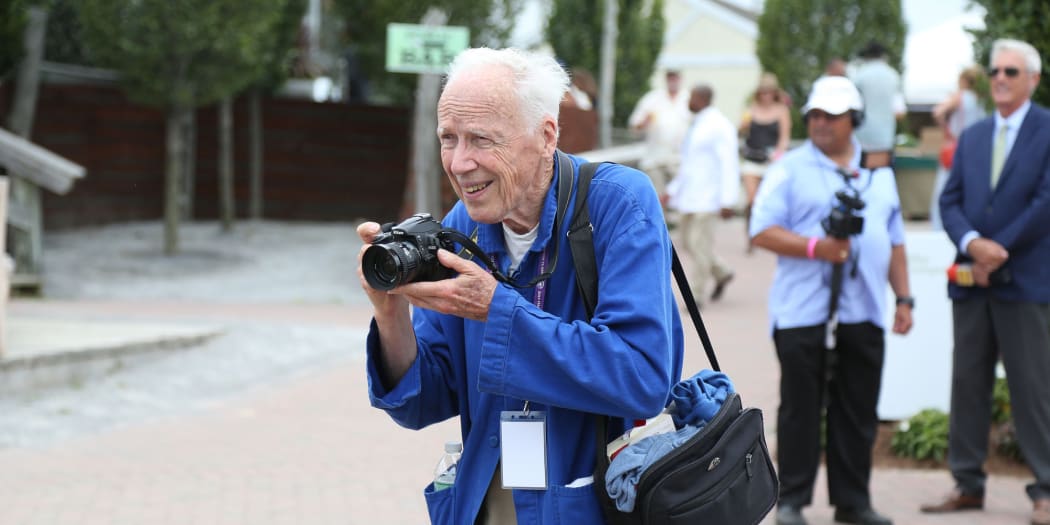 NY Times street fashion photographer Bill Cunningham at work in the Hamptons in 2014