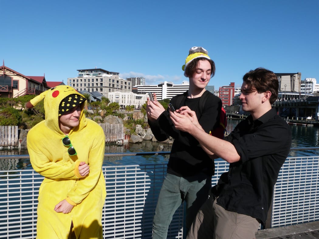 Campbell Beecroft, Charlie Jones and James Tweddell join about 1000 people to play Pokemon Go in Wellington.