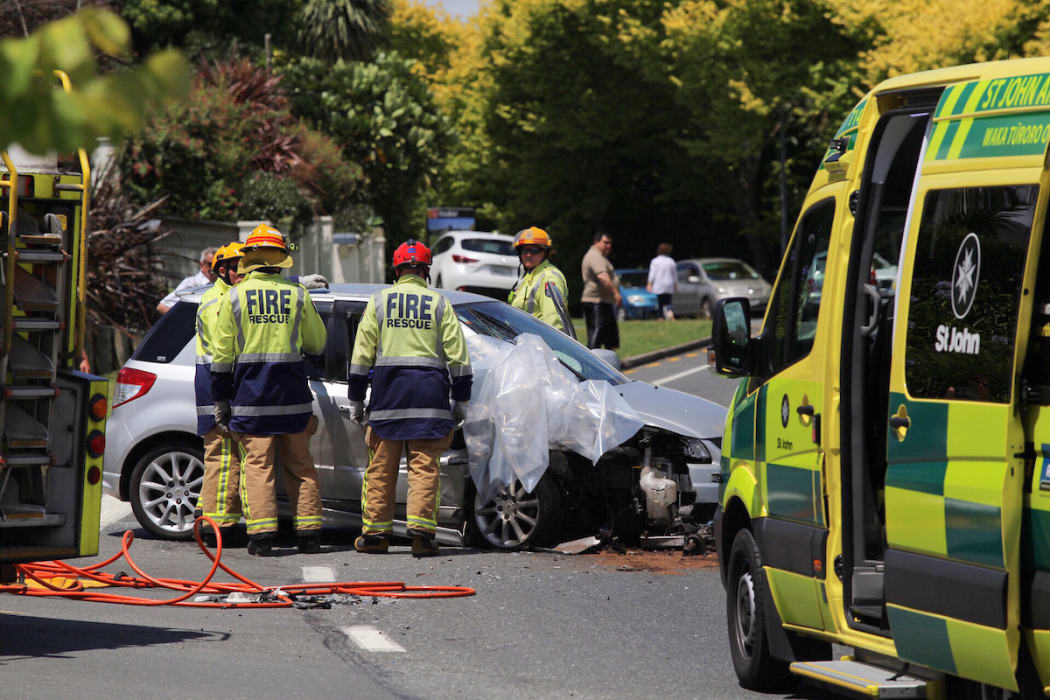 Emergency services attending a serious crash on Ohauiti Road after two cars collided.