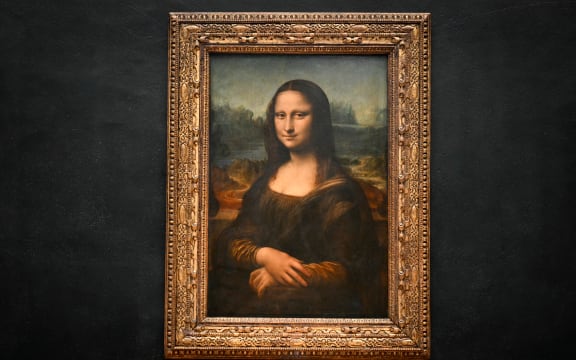 This photograph shows the painting "La Joconde" (the Mona Lisa) by Italian artist Leonardo Da Vinci at the Louvre museum in Paris on January 28, 2025.