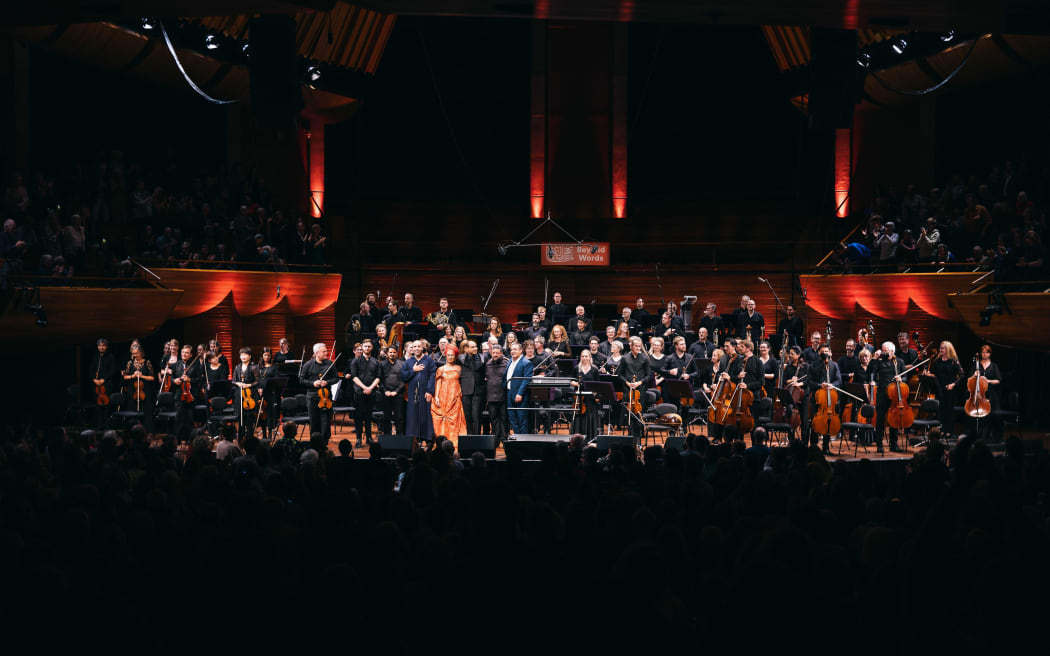 From left, NZSO Concertmaster Vesa-Matti Leppänen, saz player Liam Oliver, vocalist and daf player Esmail Fathi, vocalist Abdelilah Rharrabti, singer Oum, conductor Fawzi Haimor, oud player Kyriakos Tapakis and composer John Psathas at the Michael Fowler Centre in Wellington 9 March 2024
