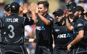 The Black Caps congratulate Trent Boult.