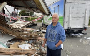 Peter Cartwright surveys the damage after a truck hit a car and his house in North End, Oamaru.