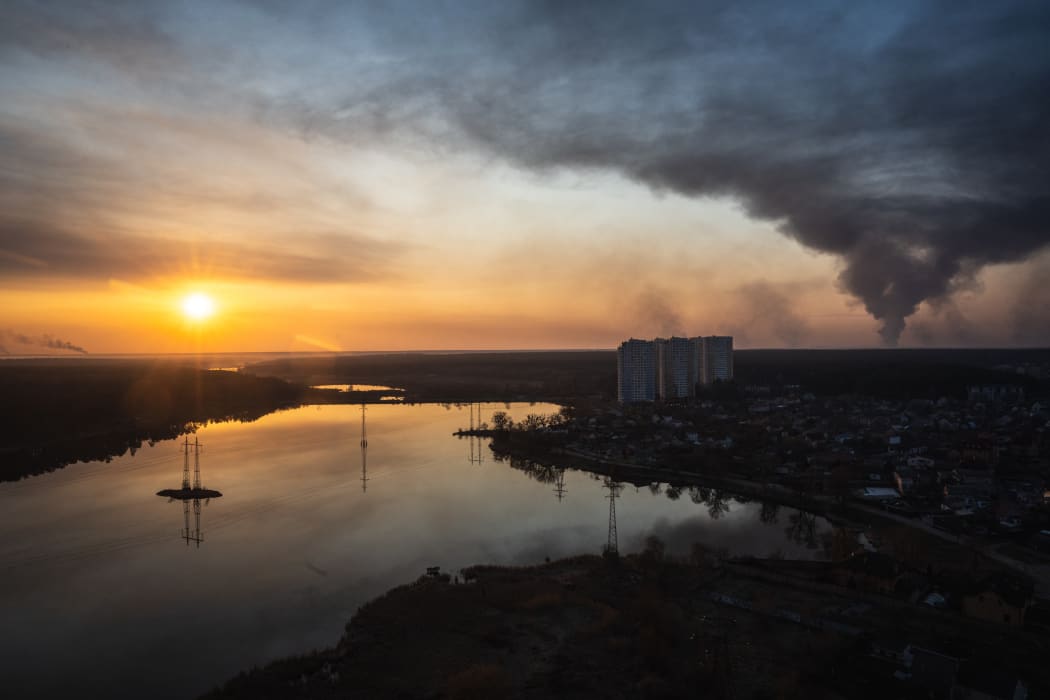 Smoke rises from the cities of Bucha, Irpin and Hostomel near Kyiv, on 25 March.