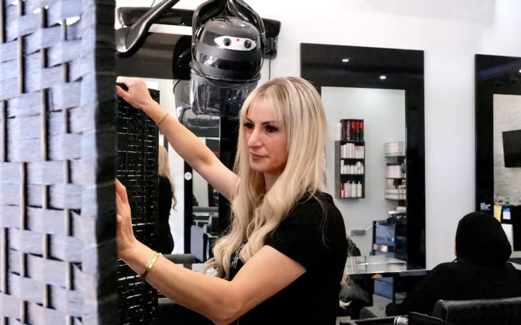 The screen dividers, or boards, are put up and down as needed in the salon.