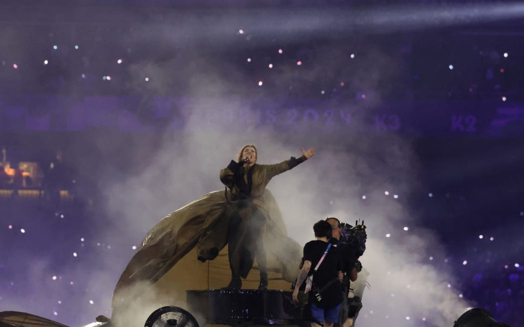 French singer Santa performs during the Paris 2024 Paralympic Games Closing Ceremony at the Stade de France, in Saint-Denis, in the outskirts of Paris, on September 8, 2024. (Photo by Thibaud Moritz / AFP)