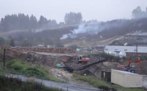 The smouldering fire in the Dunedin suburb of Burnside.