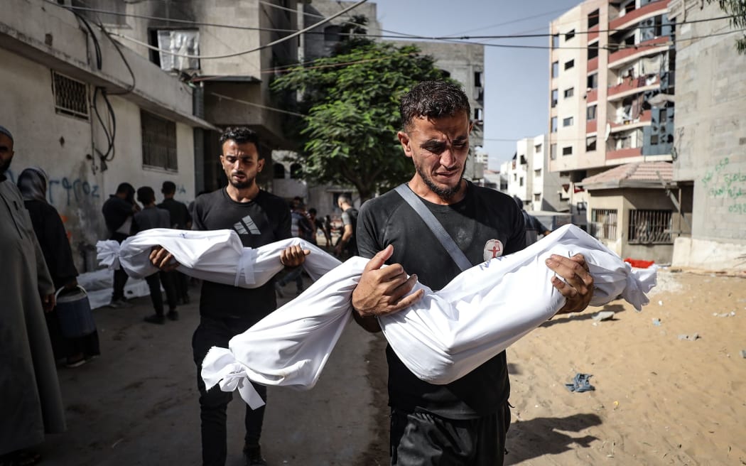 The bodies of Palestinians who were killed by an Israeli attack in Al-Shati Refugee Camp.