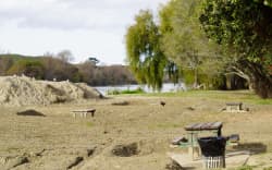 The banks of the Wairoa River, which runs through the town, remain covered in nearly a metre of silt three months after the cyclone.