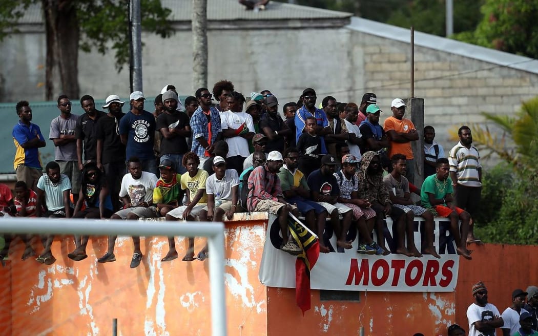 The home crowd showing their support for Vanuatu at Port Vila Stadium.