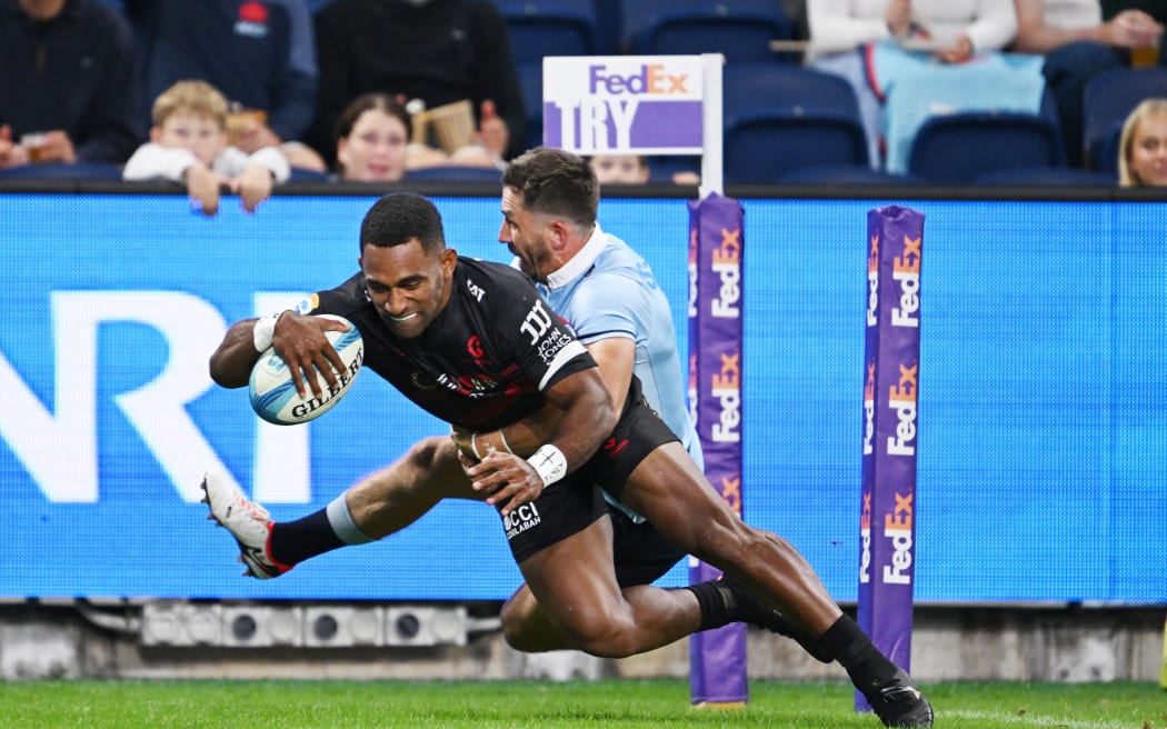 Crusaders winger Sevu Reece scores against the Waratahs.