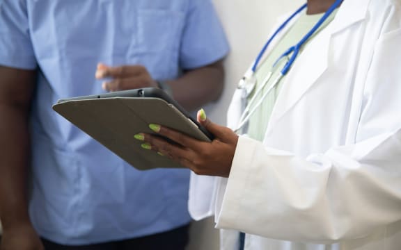 Medical staff are seen wearing scrubs, and a stethoscope.