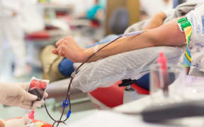 Role of nurses in blood services and donor sessions.  Nurse and blood donor at donation.