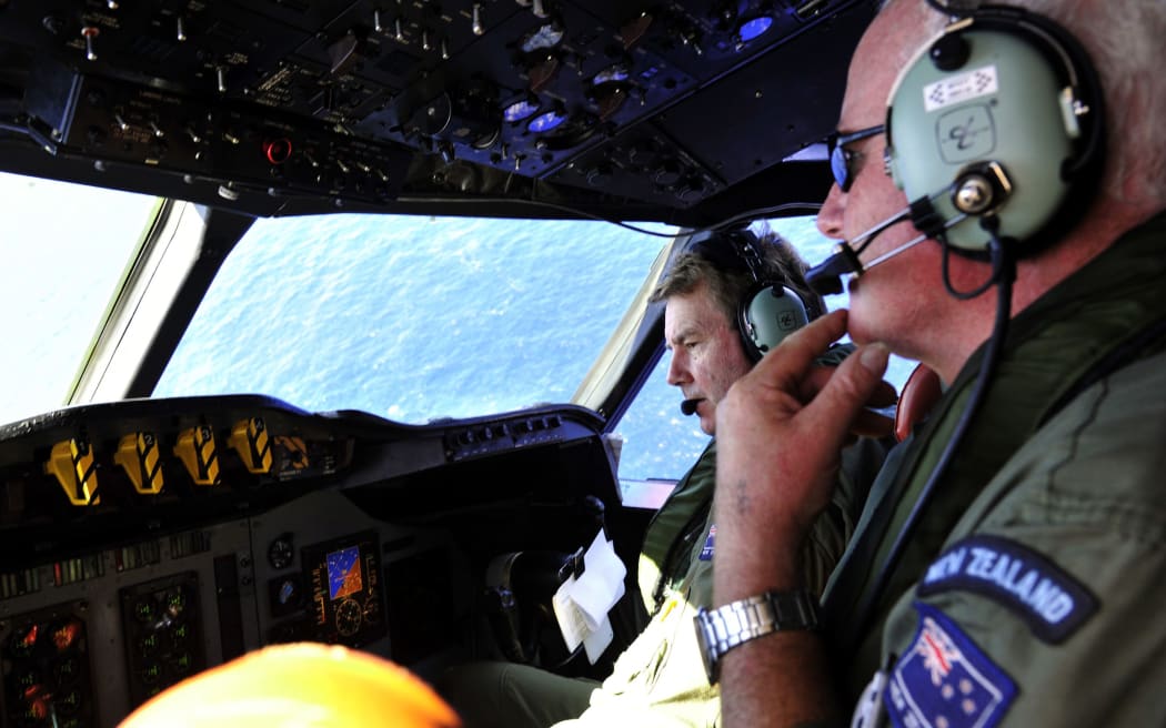 RNZAF Squadron Leader Brett McKenzie (left) and Flight Engineer Trent Wyatt aboard an Orion during the search.