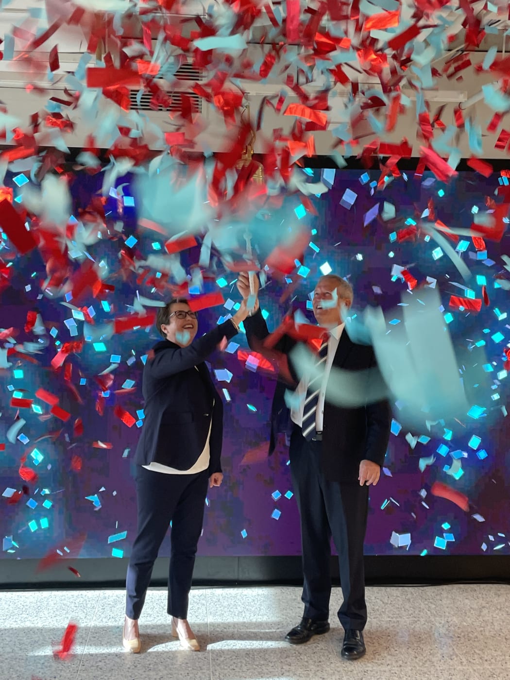 Channel Infrastructure chief executive Naomi James and company chair Simon Allen ring the bell to open trading at the NZX, marking the official launch of the rebranded company, formerly Refining NZ.