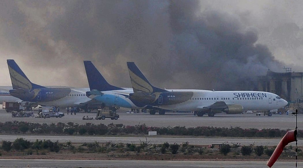 Smoke rises after militants launched an early morning assault at Jinnah International Airport.