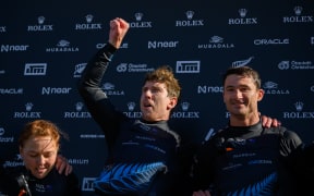 CHRISTCHURCH, NEW ZEALAND - MARCH 24: Driver Peter Burling of New Zealand (C) and his team mates celebrate their win during SailGP on March 24, 2024 in Christchurch, New Zealand. (Photo by Kai Schwoerer/Getty Images)