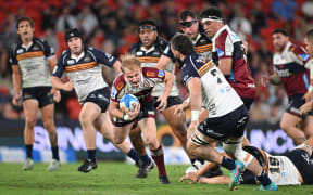 Tom Lynagh attacks for the Reds against the ACT Brumbies in a Super Rugby Pacific match at Suncorp Stadium, Brisbane, 12 April, 2025.