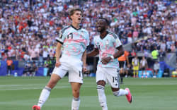 SEATTLE, WASHINGTON - JULY 06: Charles De Ketelaere #17 of Belgium celebrates with teammate Dodi Lukebakio #14 after scoring his team’s second goal during the FIFA World Cup 2026 Round of 16 match between USA and Belgium at Seattle Stadium on July 06, 2026 in Seattle, Washington. (Photo by Alex Grimm/Getty Images)