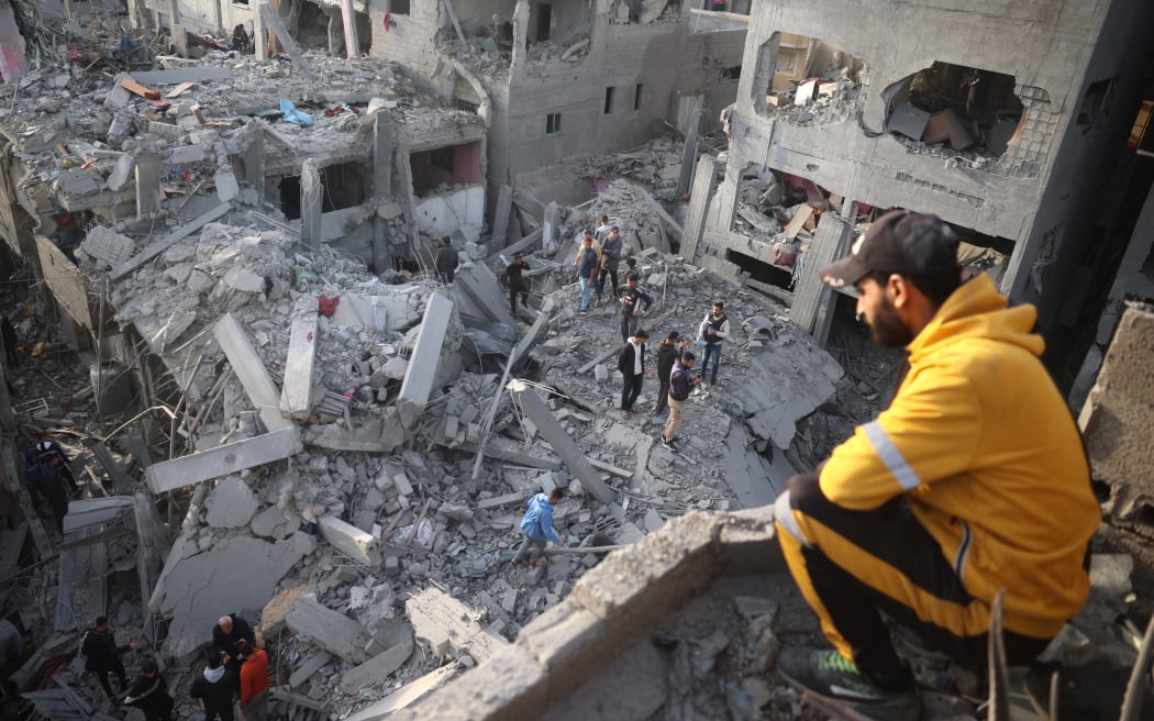 Palestinians inspect the damage after an Israeli strike on the Nuseirat refugee Camp in the central Gaza Strip on December 7, 2024, amid the ongoing conflict between Israel and the Palestinian Hamas militant group.