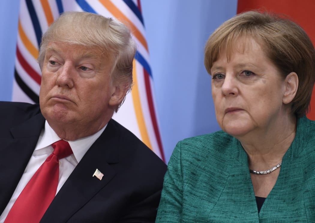 US President Donald Trump, left, and German Chancellor Angela Merkel at a panel discussion at the G20 summit in Hamburg, Germany.