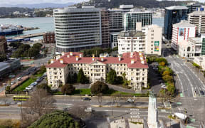 A view looking east from the roof of the Beehive including the original wooden Government Buildings (now the Victoria University of Wellington Law School).