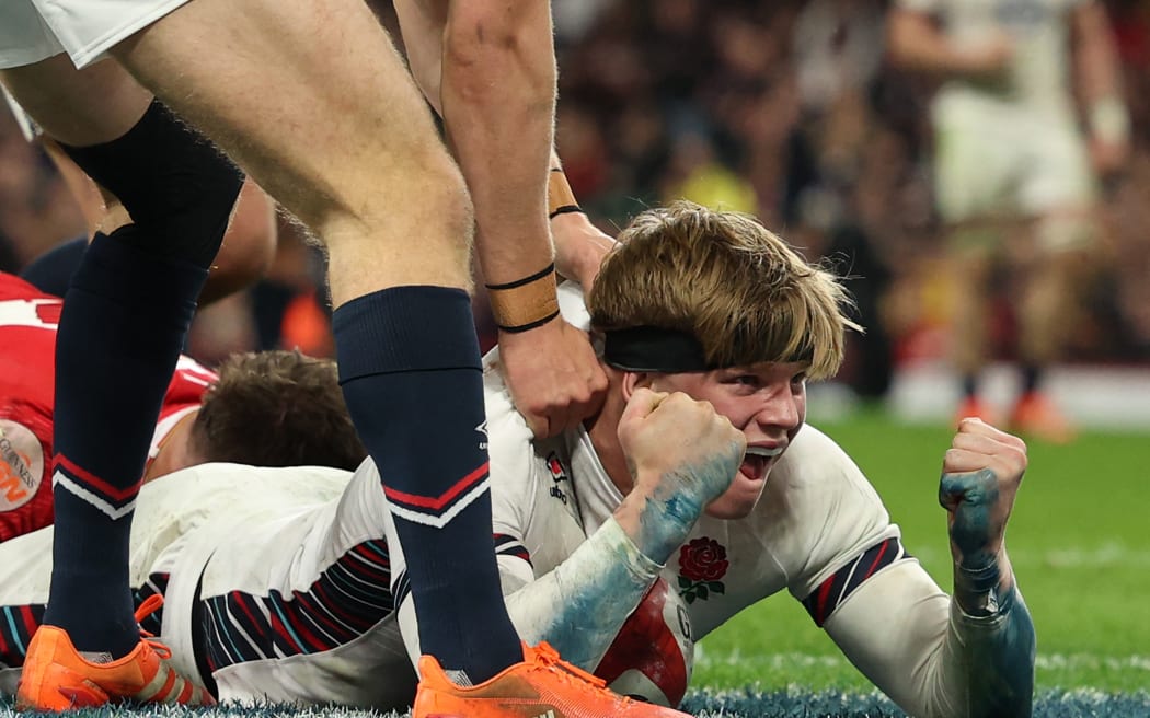 England's Henry Pollock celebrates scoring his second try during the Six Nations international against England at the Principality Stadium in Cardiff, 15 March, 2025.