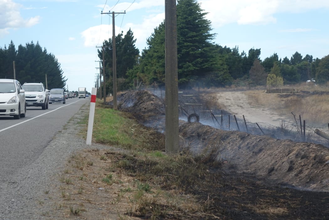 The fire started on the side of State Highway One on Monday.