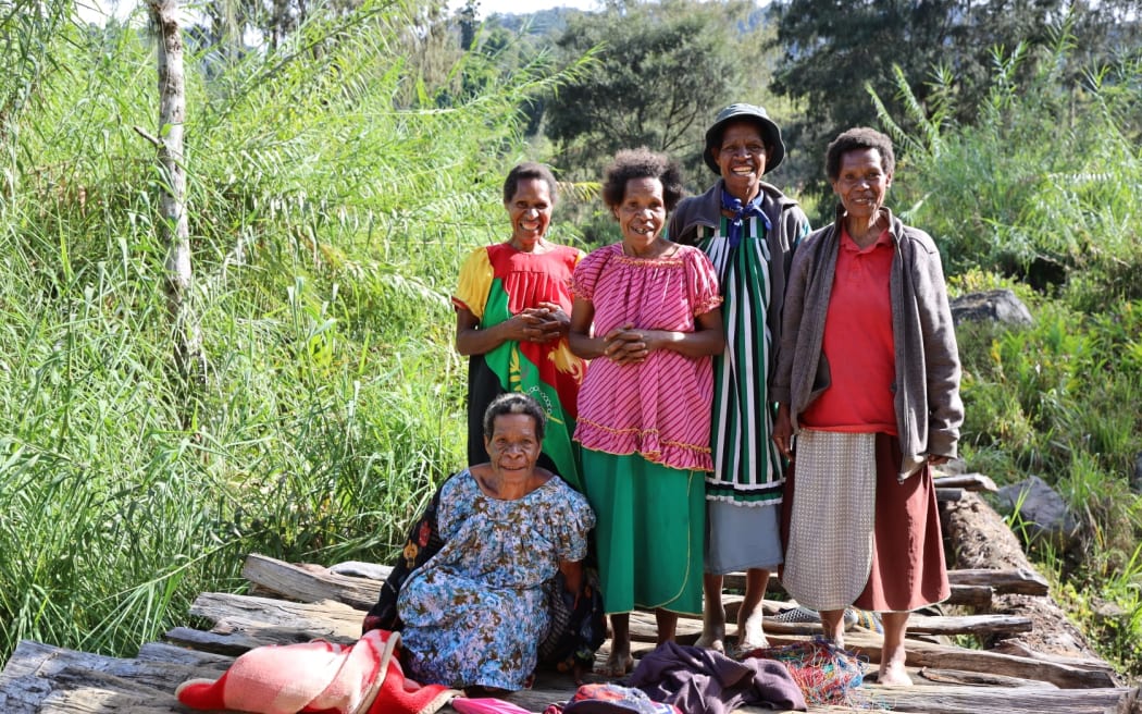 Evelyn Kunda surrounded by her family