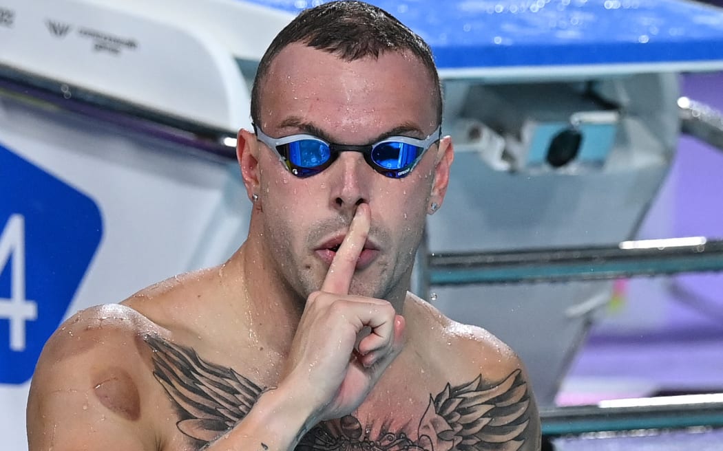 Australia's Kyle Chalmers celebrates winning and taking the gold medal in the men's 100m freestyle swimming final at the Sandwell Aquatics Centre.