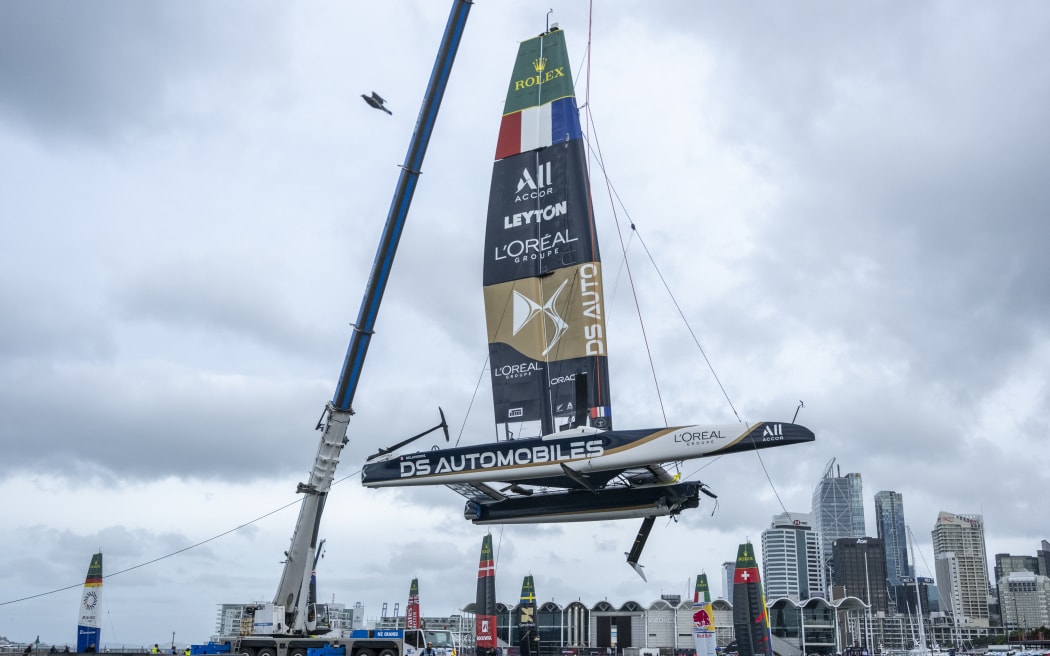 The damaged boat of the DS Automobiles SailGP Team France is craned from the water in the technical area after a collision with Black Foils SailGP Team during racing on Race Day 1 of the ITM New Zealand Sail Grand Prix in Auckland, New Zealand. Saturday 14 February 2026. Rolex SailGP Championship Event 2 2026 Season. Photo: James Gourley for SailGP. Handout image supplied by SailGP