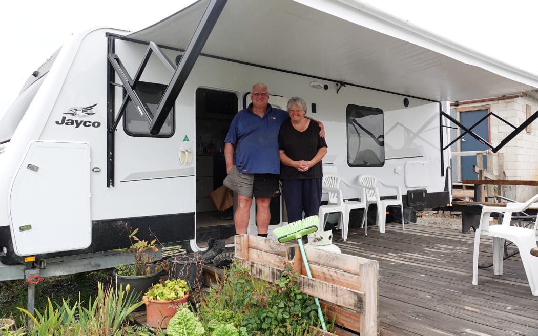 Raymond and Cynthea Greene outside the caravan that has been their home since May 2023.