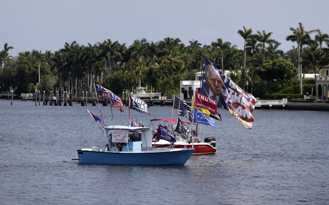 PALM BEACH, FLORIDA - APRIL 02: Supporters of former U.S. president Donald Trump travel in boats near his Mar-a-Lago home on April 2, 2023 in Palm Beach, Florida. According to reports, Trump has been indicted by a Manhattan grand jury on more than 30 counts related to business fraud.   Alon Skuy/Getty Images/AFP (Photo by Alon Skuy / GETTY IMAGES NORTH AMERICA / Getty Images via AFP)
