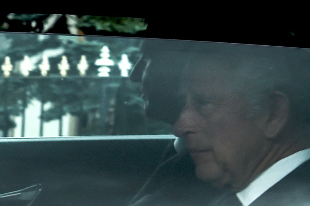 King Charles III (R) is driven away from Balmoral Castle in Ballater, a day after Queen Elizabeth II died.