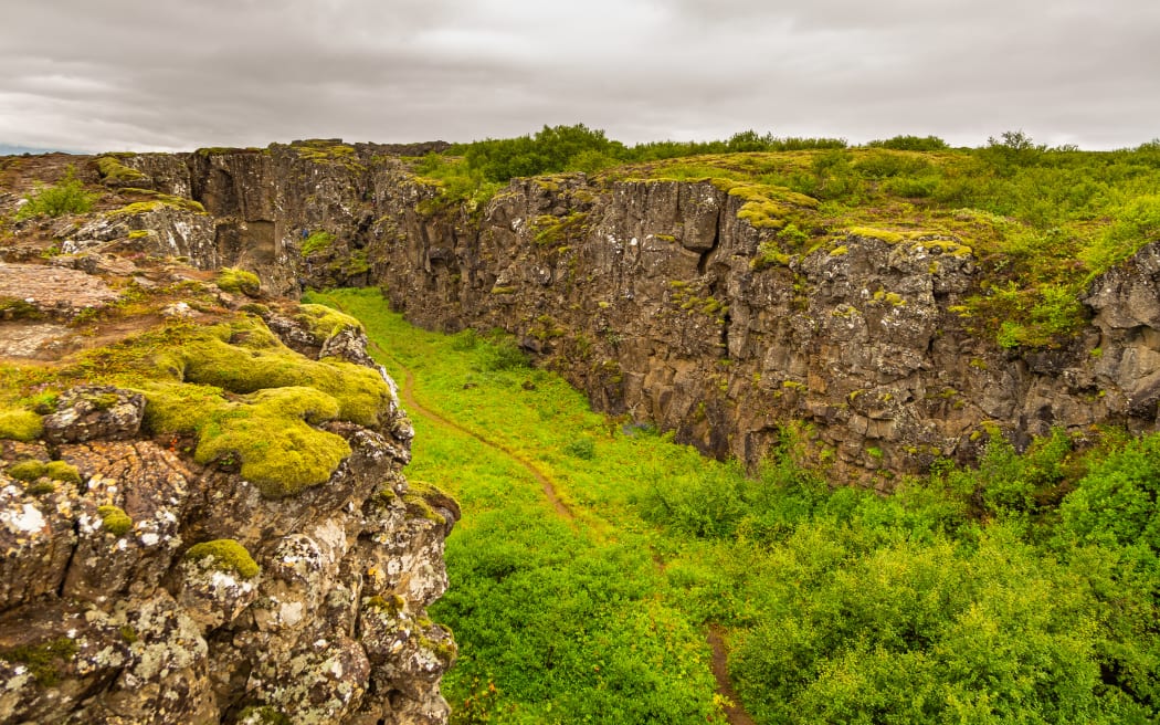 The rift valley in Iceland marks the crest of the Mid-Atlantic Ridge and the boundary between the North American and Eurasian tectonic plates.