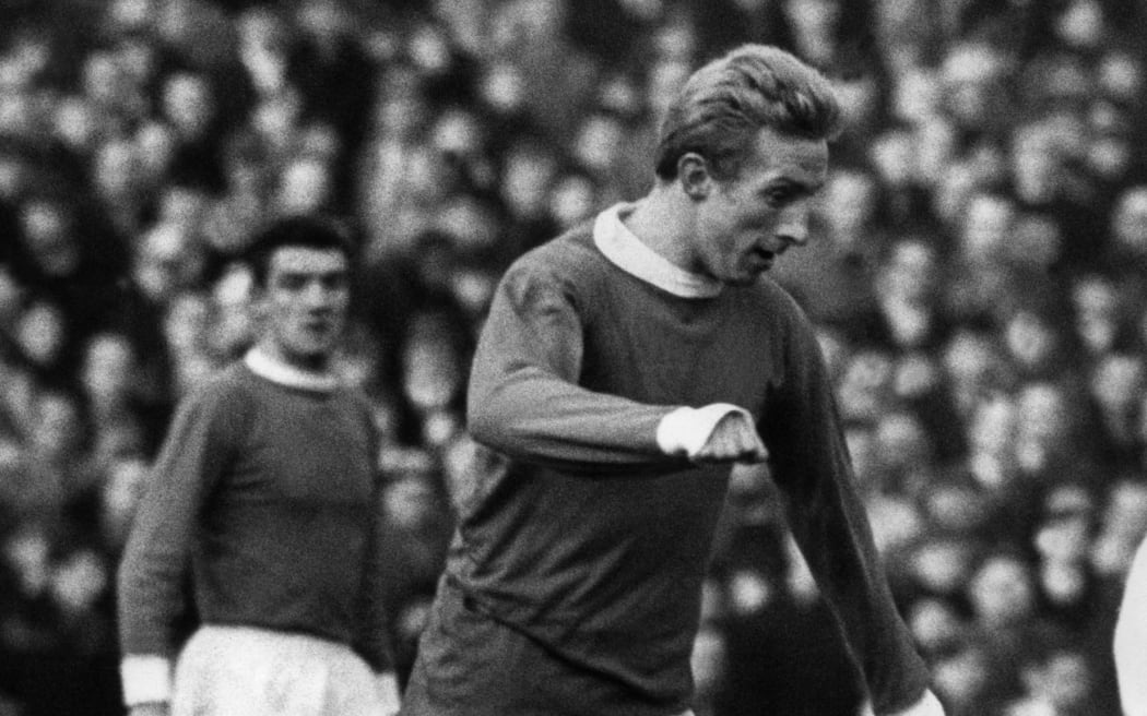 Scottish Manchester United's forward Denis Law dribbles during a Premier League soccer match 20 January 1966 in Manchester.
 AFP PHOTO/CENTRAL PRESS (Photo by STAFF / CENTRAL PRESS / AFP)
