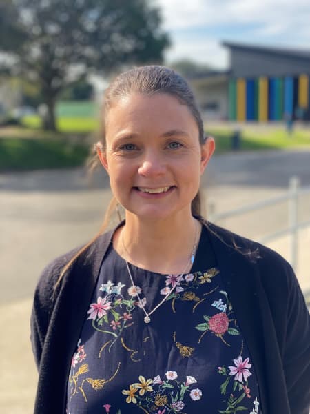 Laura Ferris, Associate Principal at Oranga School standing in the playground.