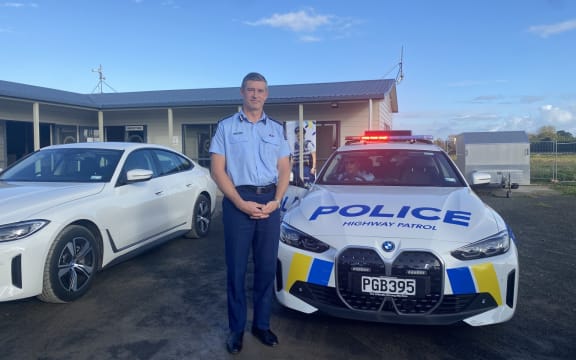 Police electric vehicle  - BMW i4 - and Andrew Coster