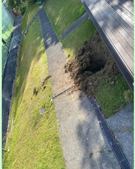 The gaping hole left behind after the theft of the honesty box.