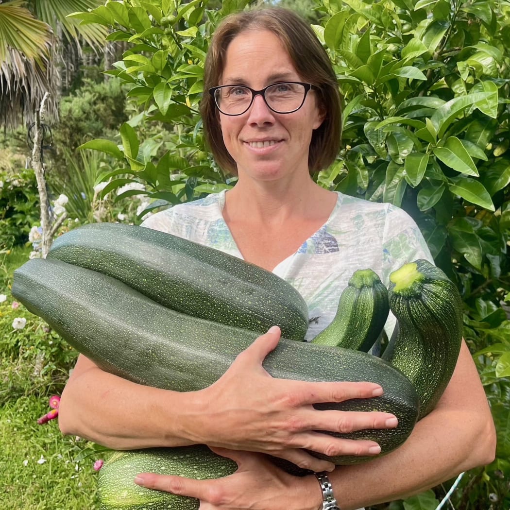 Michelle Lachmann holding zucchinis that were grown with Herbi's Living Soil Growing mix.