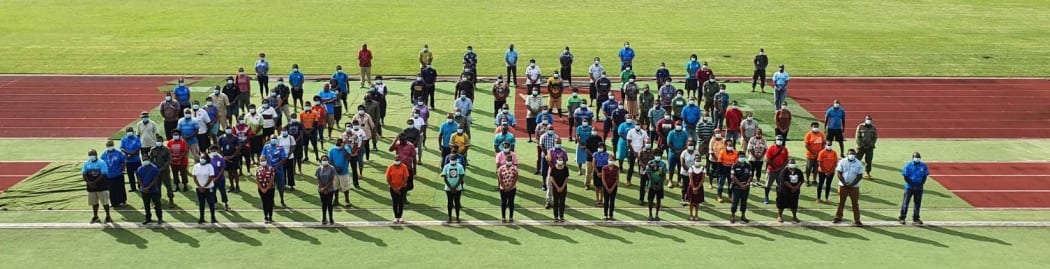 Staff at a MIQ facility in Fiji assemble for a briefing.
