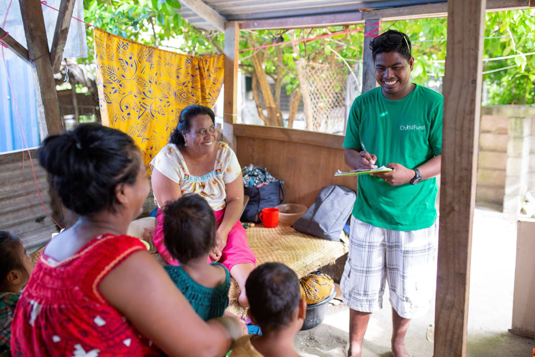 Child Fund NZ staff in Kiribati visit a family in Betio, Tarawa.