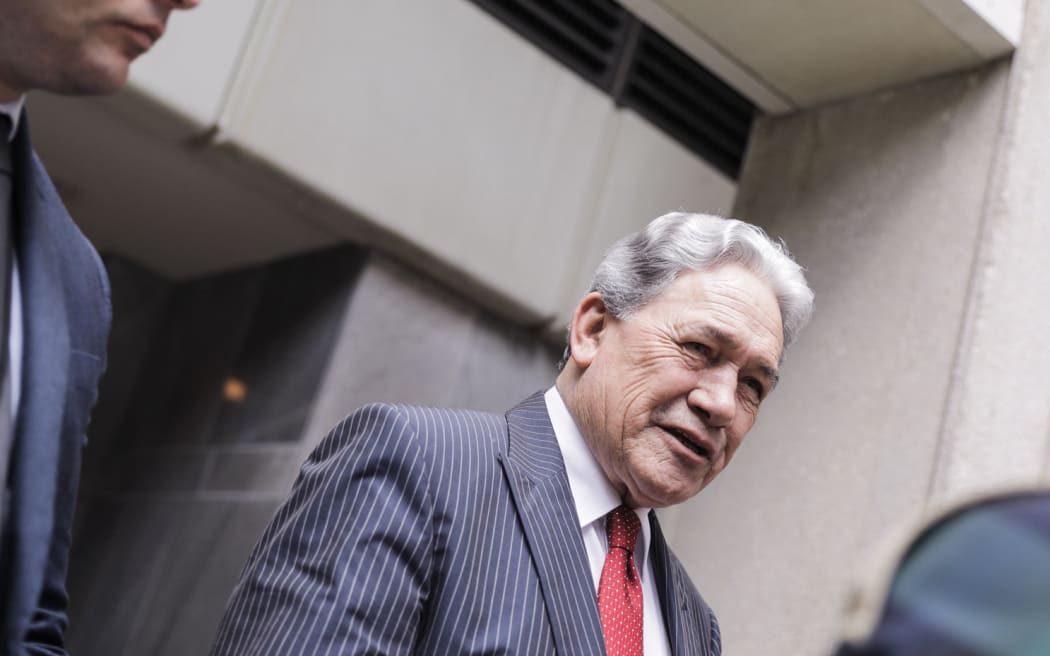 Winston Peters speaks to media after emerging from the Treasury offices, as negotiations for forming a government with National and ACT continue.