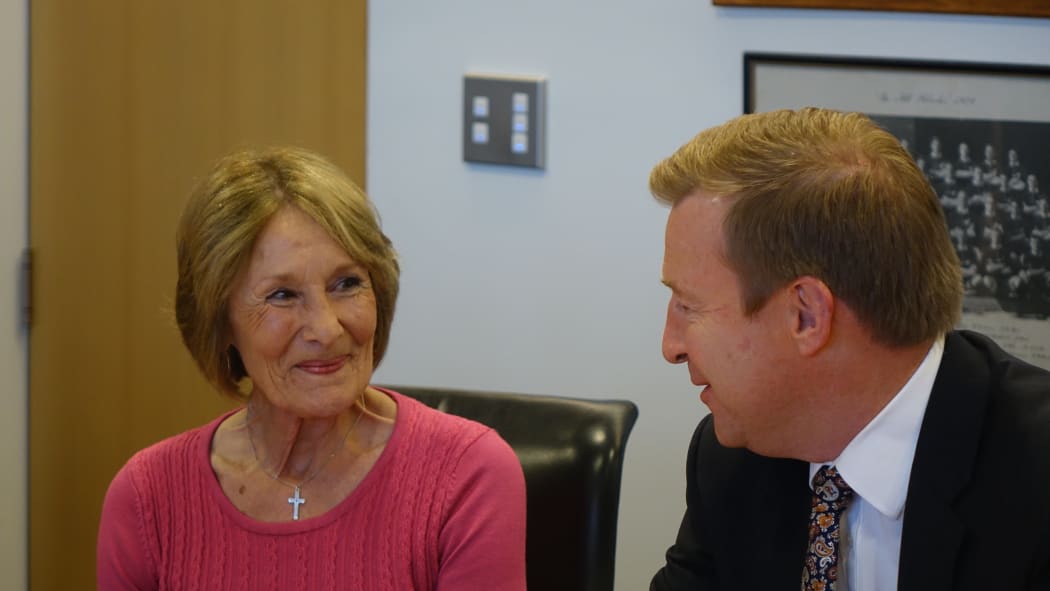 Kristine Bartlett, who took the initial case in the Employment Court, with Health Minister Jonathan Coleman as he signs the deal.