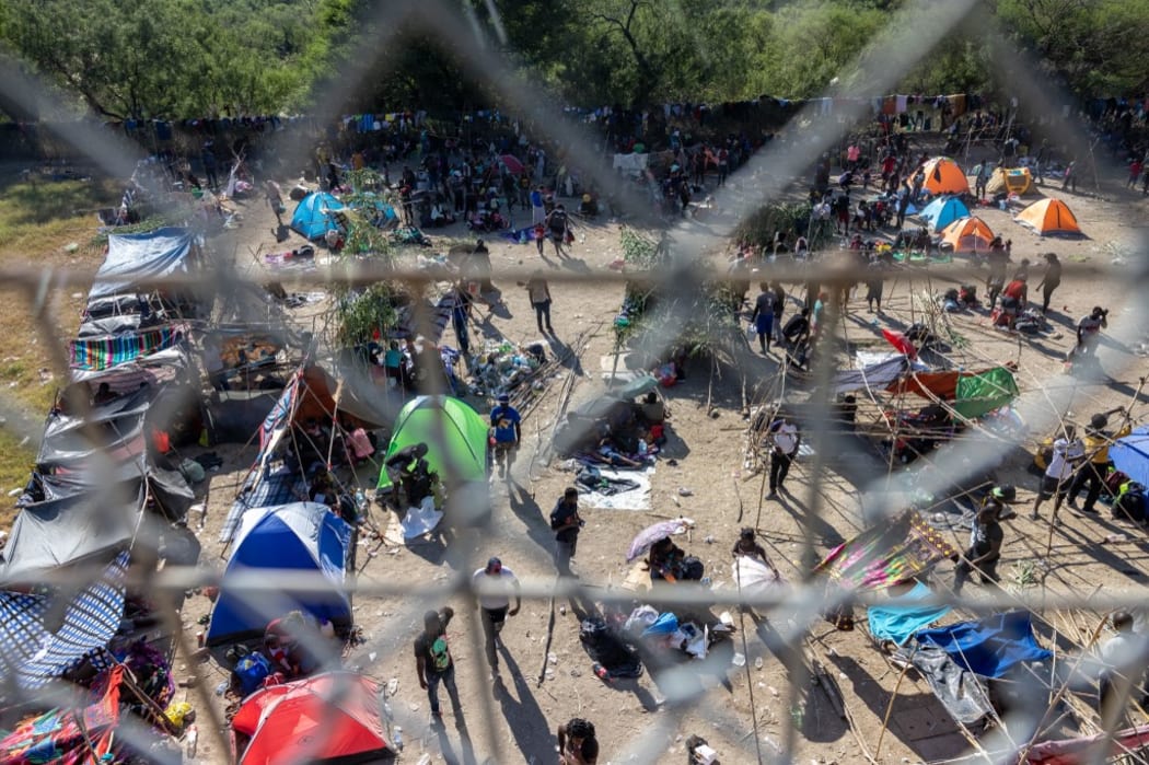 Thousands of migrants, mostly from Haiti, gather at a makeshift encampment under the International Bridge between Del Rio, TX and Acuña, Mexico.